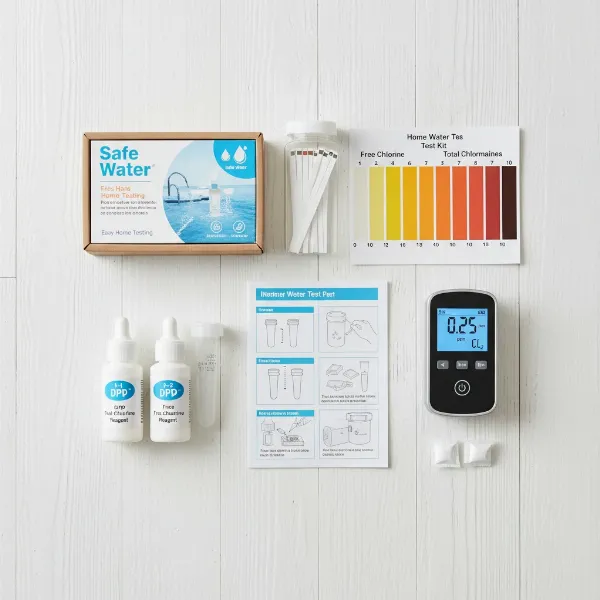Assortment of home water test kits including strips, liquid drop kits, and a digital colorimeter.
